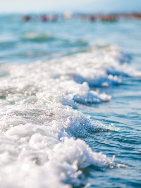 The shimmering sun shines on the sea floor.